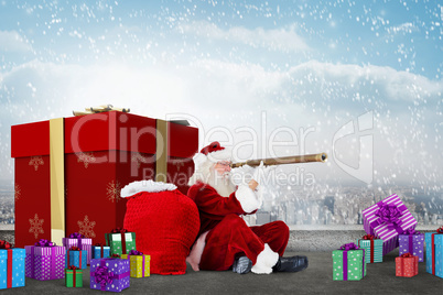 Composite image of santa looking through a telescope