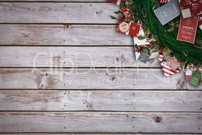 Composite image of festive christmas wreath with decorations