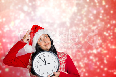 Composite image of woman thinking about the time