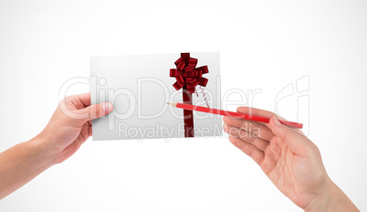 Composite image of hand holding card