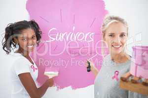 Composite image of smiling housemates painting wall pink