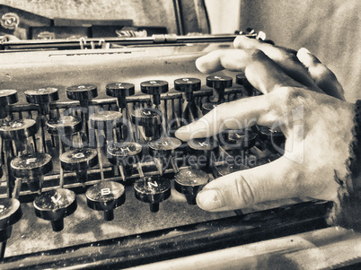 Baby hand typing on a old typewriter