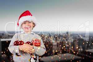 Composite image of festive boy smiling