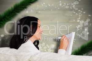 Composite image of woman writing down some notes