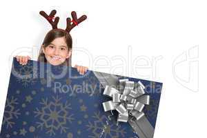 Composite image of festive little girl showing card