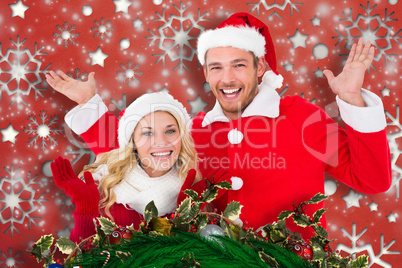 Composite image of young festive couple