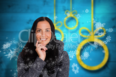 Composite image of woman smiling at the camera