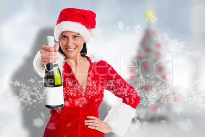 Composite image of woman holding a champagne bottle