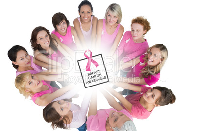 Composite image of cheerful women joined in a circle and looking