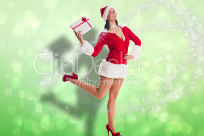 Composite image of woman smiling with christmas present