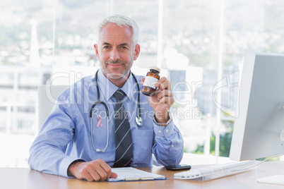 Composite image of doctor holding medicine jar