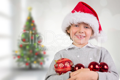 Composite image of festive boy smiling