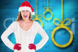 Composite image of festive blonde shouting at camera