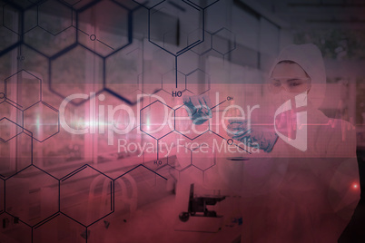 Composite image of chemist in protective suit working with futur