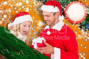 Composite image of young festive couple