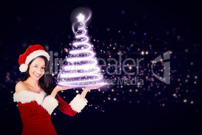 Composite image of pretty girl presenting in santa outfit