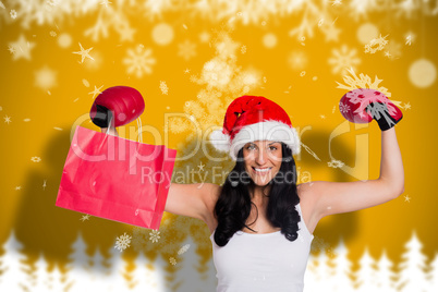 Composite image of woman wearing red boxing gloves