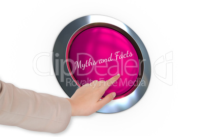 Hand pressing pink button for breast cancer awareness