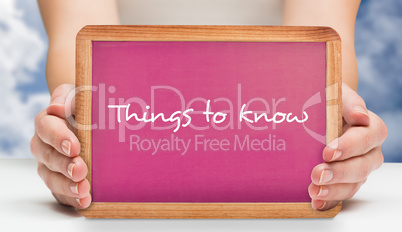 Composite image of females hands showing pink board