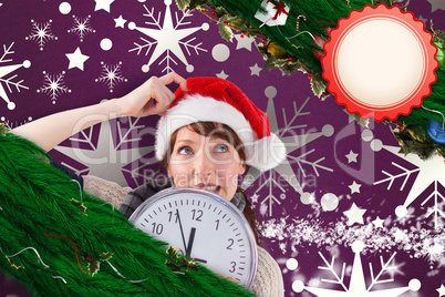 Composite image of woman holding a large clock