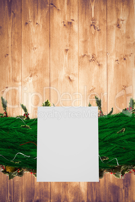 Composite image of fir branch christmas decoration garland