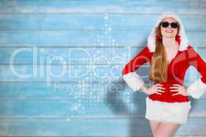 Composite image of cool santa girl wearing sunglasses