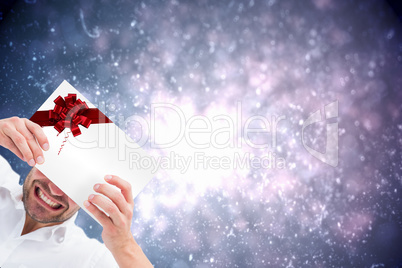 Festive man holding a christmas gift