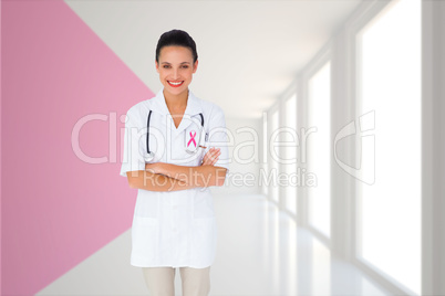 Composite image of pretty nurse with arms crossed