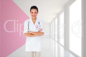 Composite image of pretty nurse with arms crossed