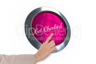 Hand pressing pink button for breast cancer awareness