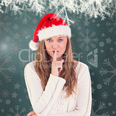 Composite image of festive blonde keeping a secret