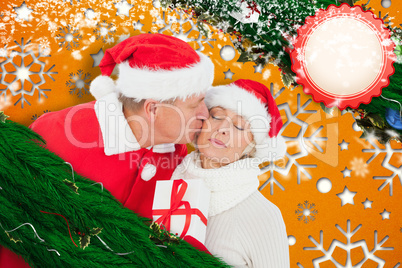 Composite image of festive mature couple holding gift Composite image of festive mature couple holding gift