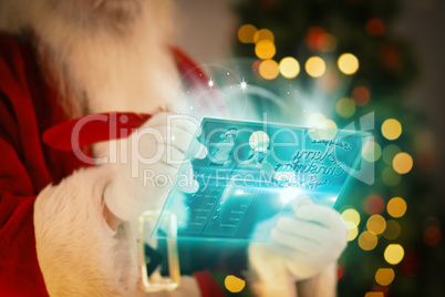 Composite image of santa using futuristic touchscreen