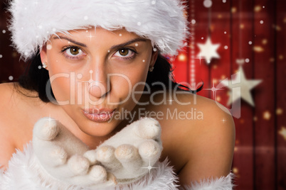 Composite image of woman blowing kiss to camera