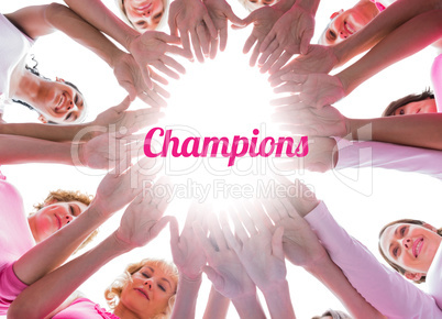 Happy women in circle wearing pink for breast cancer