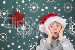 Composite image of festive surprised boy