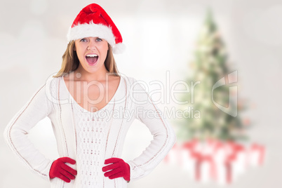 Composite image of festive blonde shouting at camera