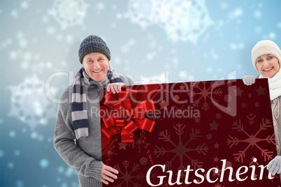 Composite image of winter couple showing poster