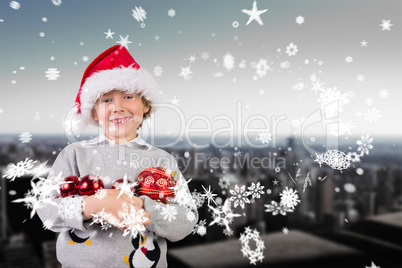 Composite image of festive boy smiling