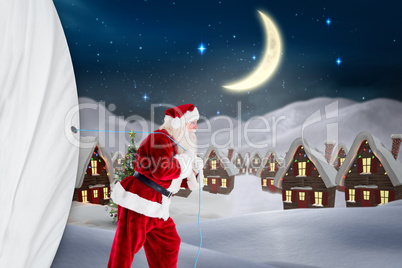 Composite image of santa claus pulling rope