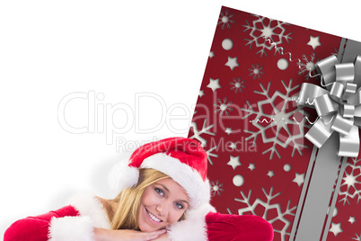 Composite image of festive blonde smiling at camera