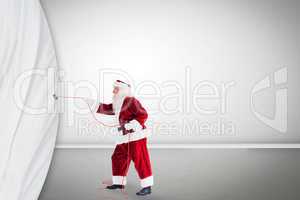 Santa pulls curtain with a rope