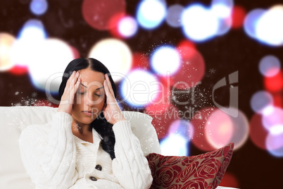 Composite image of woman suffering from a migraine