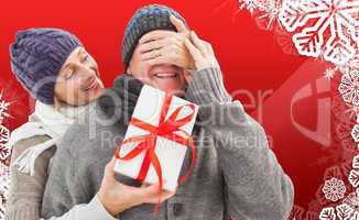 Composite image of mature woman surprising partner with gift