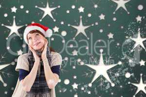 Smiling woman wearing santa hat