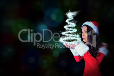 Composite image of pretty girl in santa outfit blowing