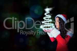 Composite image of pretty girl in santa outfit blowing