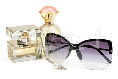 perfume bottles, sunglasses and chain
