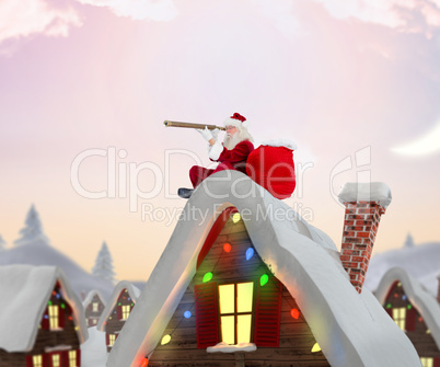 Composite image of santa sitting on roof of cottage