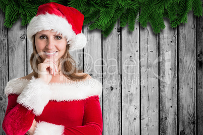 Composite image of pretty girl in santa outfit